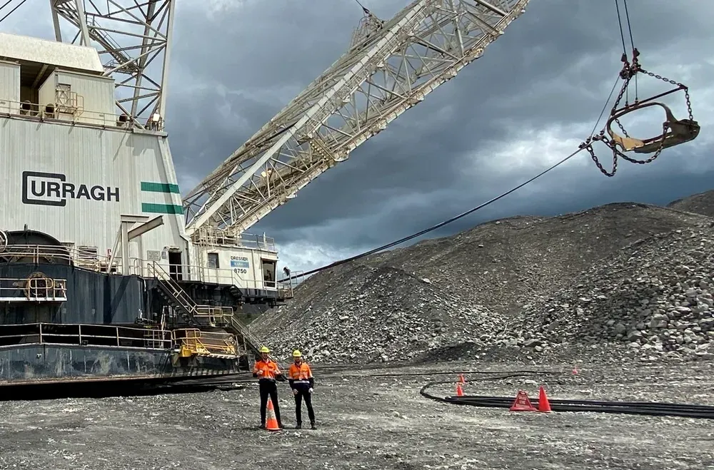 Two Bigmate engineers in high-visibility gear beside a dragline at Coronado&rsquo;s Curragh mine